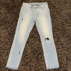 Light blue jeans with black stitching